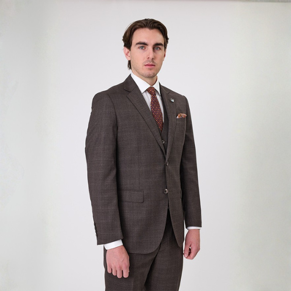 Model in chocolate brown Savile Row suit
