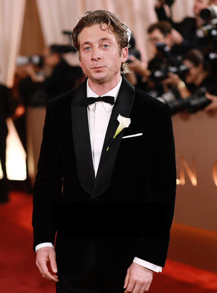 Jeremy Allen White at the 2026 Golden Globes wearing a shawl lapel tuxedo and a batwing bowtie