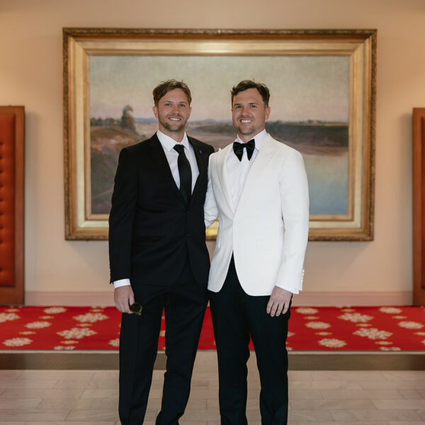 Groom and groomsman in suiting looks from Rundle Tailoring